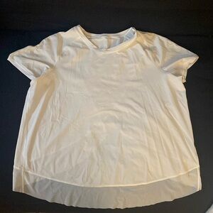 Beautiful white short sleeve with beautiful sheer detail in the front and back.